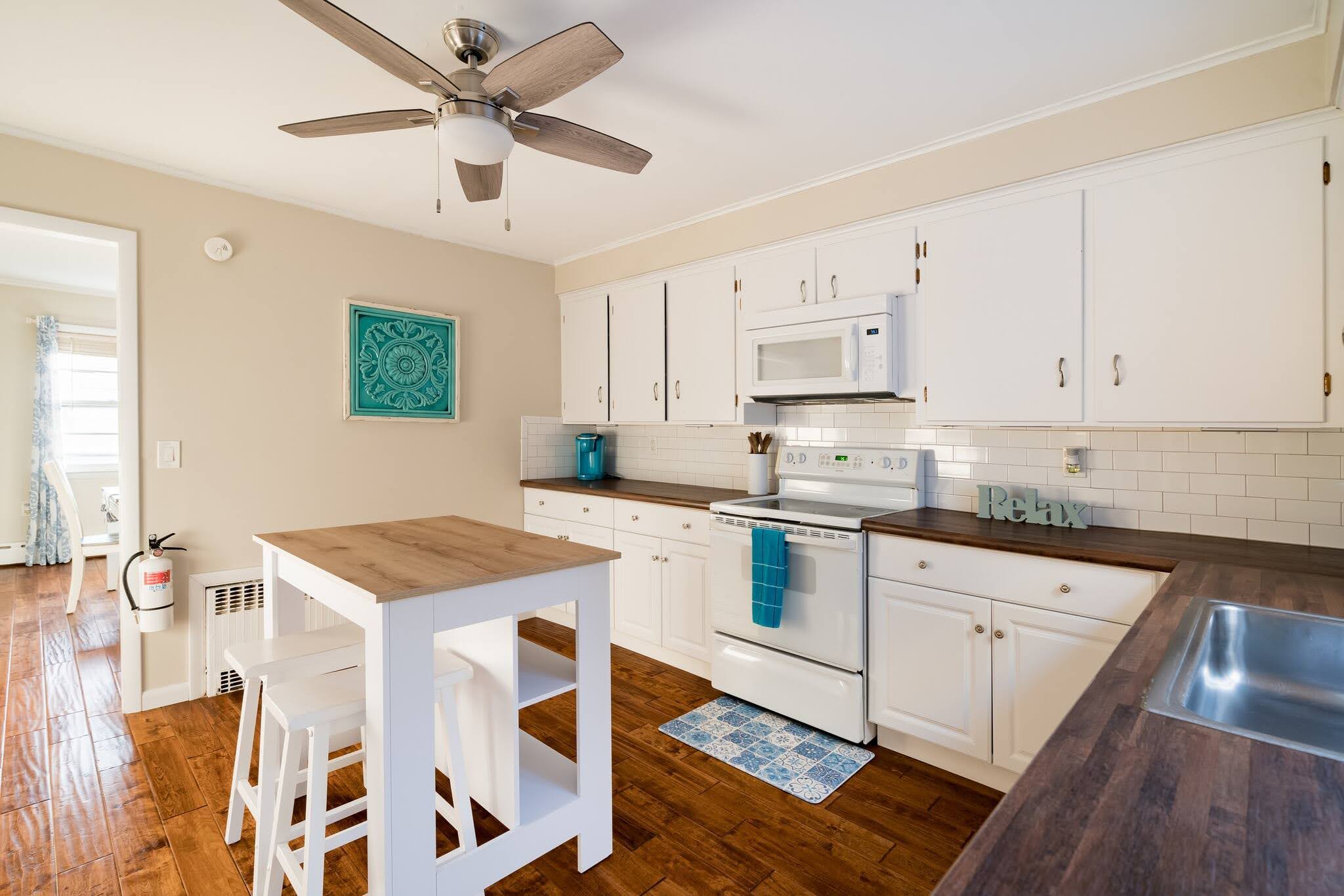 Bright kitchen with breakfast bar and subway tile
